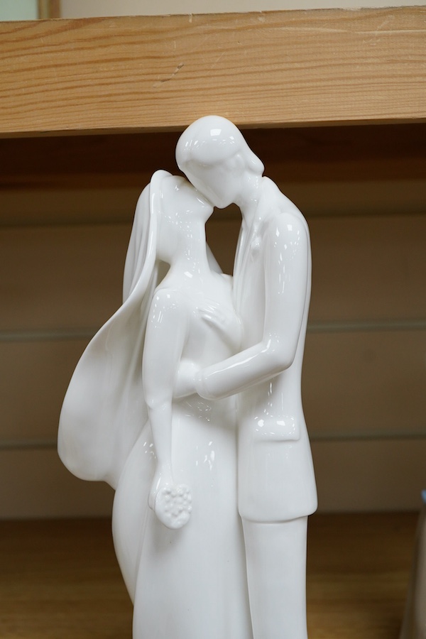 A Royal Doulton Images group and four LLadro figures